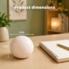 NeeDoh Snowball – slow rebound squish toy (6/6) NeeDoh Snowball pink stress ball on a desk — Image 6 of 6