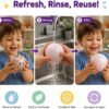 NeeDoh Snowball – slow rebound squish toy (3/6) NeeDoh Snowball pink stress ball on a desk — Image 3 of 6
