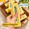 NeeDoh Butter Squishy realistic slow-rise butter stick toy in hand — Image 5 of 12