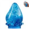 NeeDoh Dream Drop – Blue Squish Toy (1/7) Blue NeeDoh Dream Drop raindrop squish toy resting on a translucent stand — Image 1 of 7